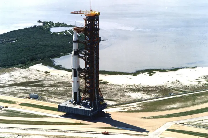 The crawler carries Apollo 11's 363-foot Saturn V toward Launch Pad 39A at Kennedy Space Center, 20 May 1969