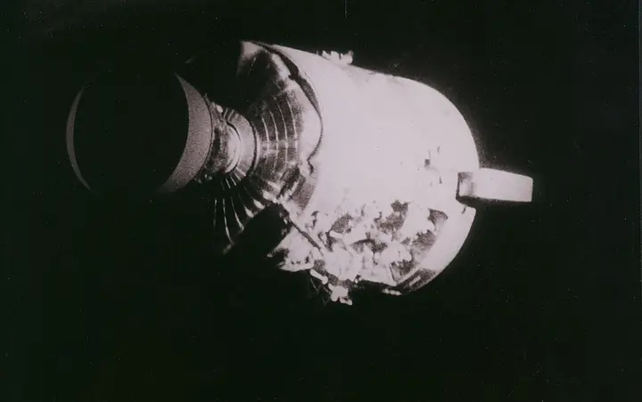 The service module after jettison, with one whole side blown out by the oxygen tank explosion, 17 April 1970