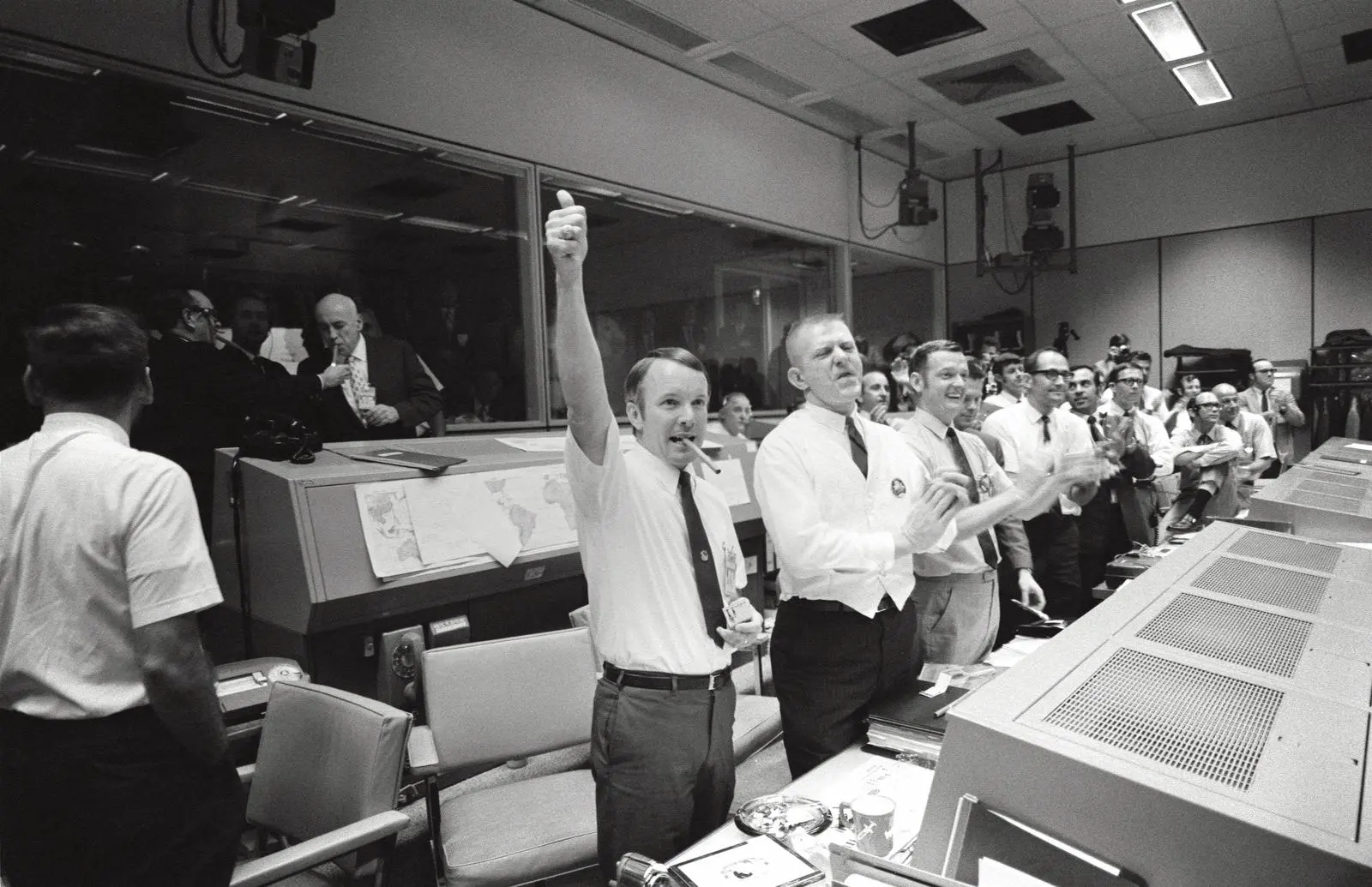 Flight directors Gerry Griffin, Gene Kranz and Glynn Lunney cheer the splashdown in Mission Control, 17 April 1970