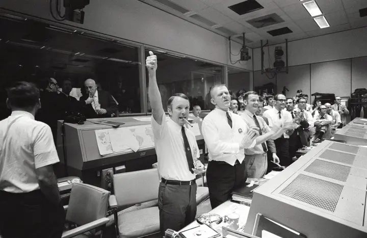 Flight directors Gerry Griffin, Gene Kranz and Glynn Lunney cheer the splashdown in Mission Control, 17 April 1970