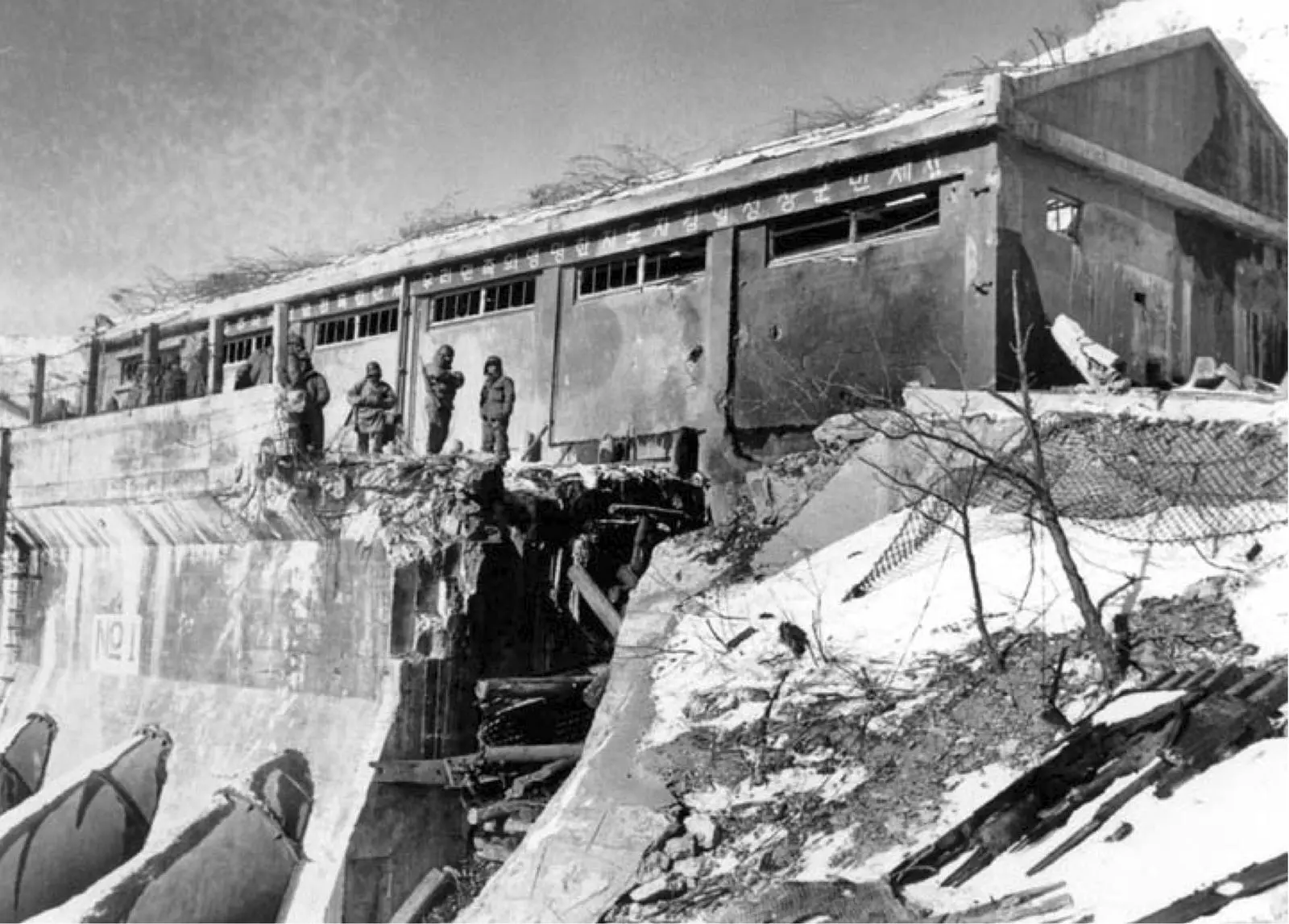 The blown bridge over the penstocks in Funchilin Pass: the gap the division had to span to bring its vehicles out, December 1950 (A5376)
