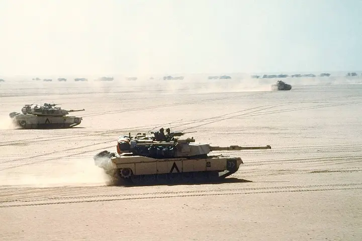 M1A1 Abrams tanks of the 3rd Armored Division, VII Corps, move out across the Saudi desert, 15 February 1991.