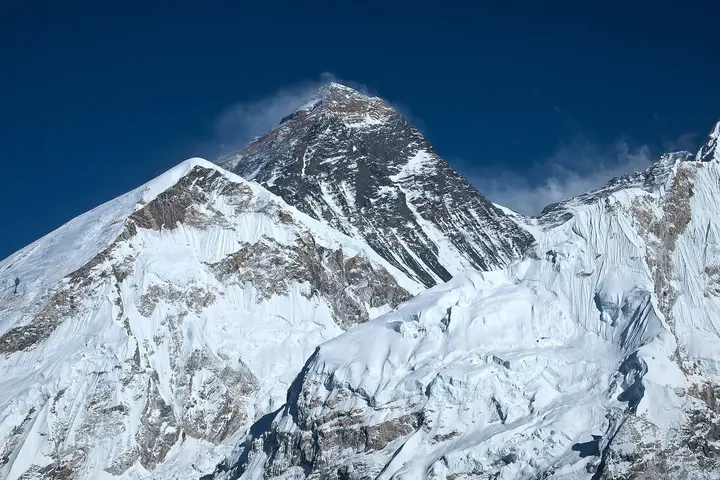 Mount Everest from the Khumbu in Nepal, the side the 1963 team climbed, with a plume of snow streaming off the summit.