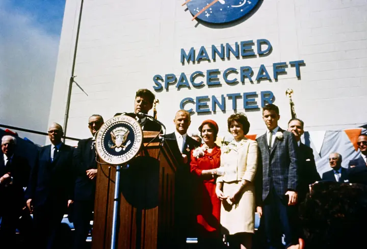 President Kennedy honors Glenn at Cape Canaveral, with Annie, Lyn and David Glenn beside him, 23 February 1962 (KSC-JohnGlenn-0009)