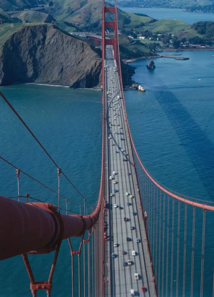Looking north down the deck from the top of the south tower, with the main cable at left, 1984.