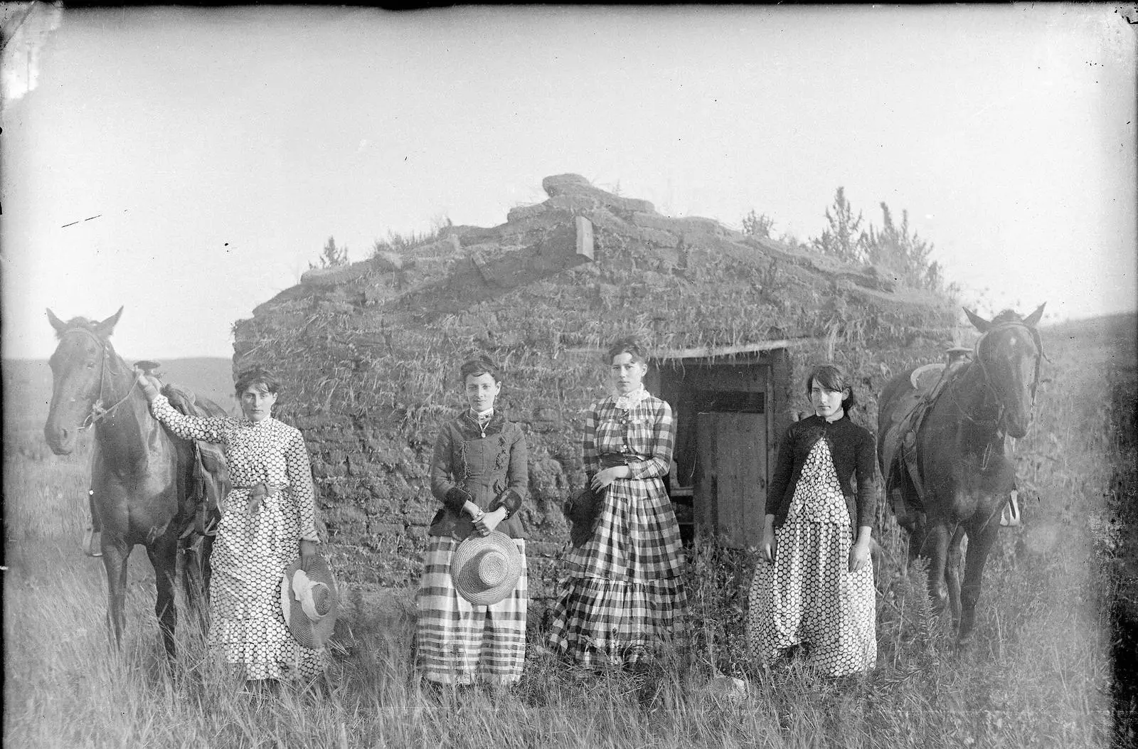 Hattie, Lizzie, Lutie and Ruth Chrisman in front of Lizzie's sod house in Custer County, Nebraska, in 1886. All four sisters went on to file homesteads.