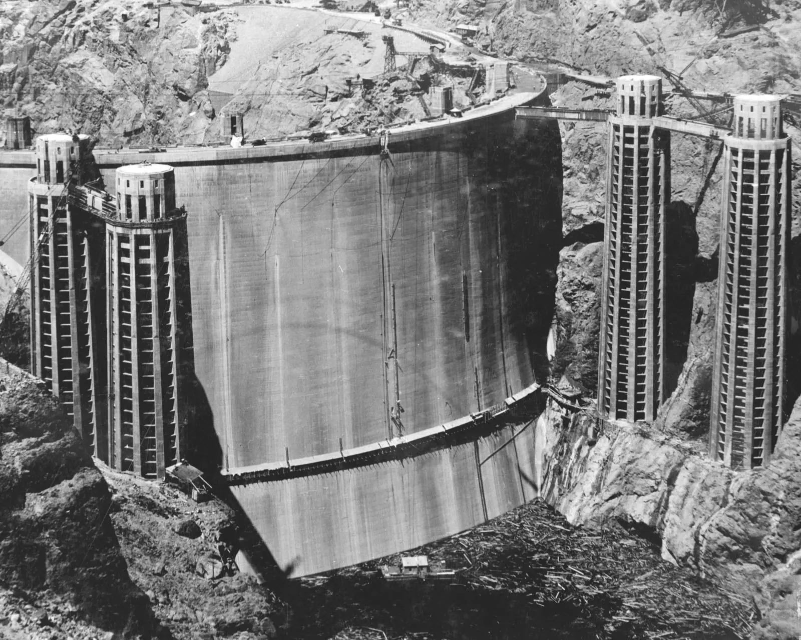 The upstream face of the finished dam and its four intake towers, before Lake Mead rose to cover them, May 22, 1935