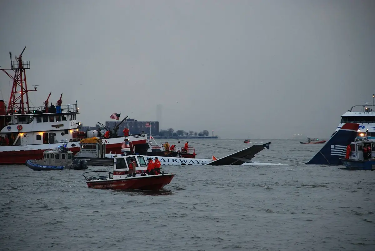 FDNY fireboats, police launches and ferries close around the Airbus as rescuers secure it in the Hudson, 15 January 2009