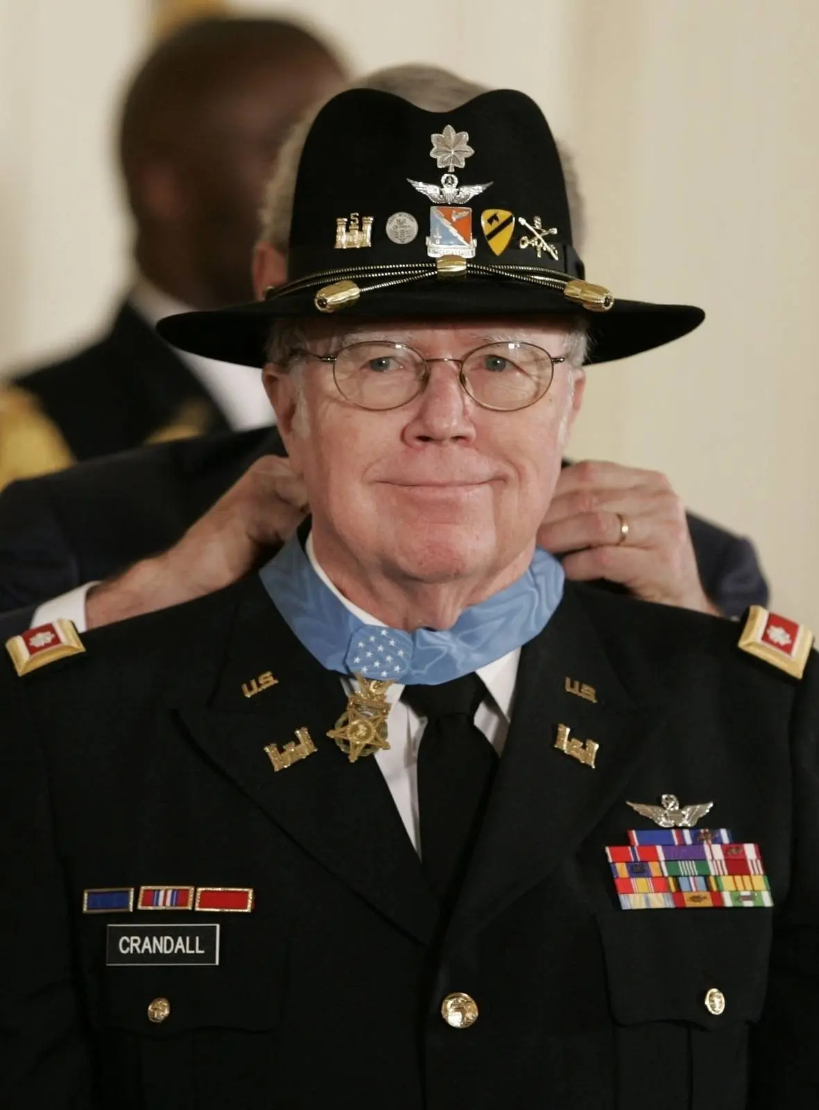 President Bush fastens the Medal of Honor on Bruce Crandall at the White House, 26 February 2007.