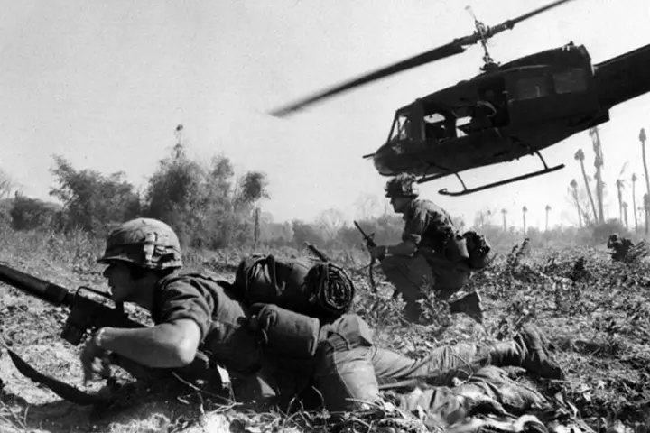 Maj. Bruce Crandall’s UH-1D Huey climbs away after landing infantrymen of the 1st Cavalry Division in the Ia Drang Valley, November 1965.