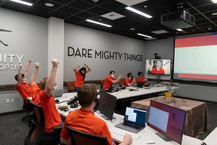 The Ingenuity team in JPL's Space Flight Operations Facility reacts as data confirm the first flight, 19 April 2021