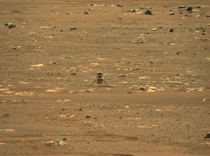 Perseverance's Mastcam-Z looks across Jezero Crater at Ingenuity, back on the ground after its first flight, 19 April 2021