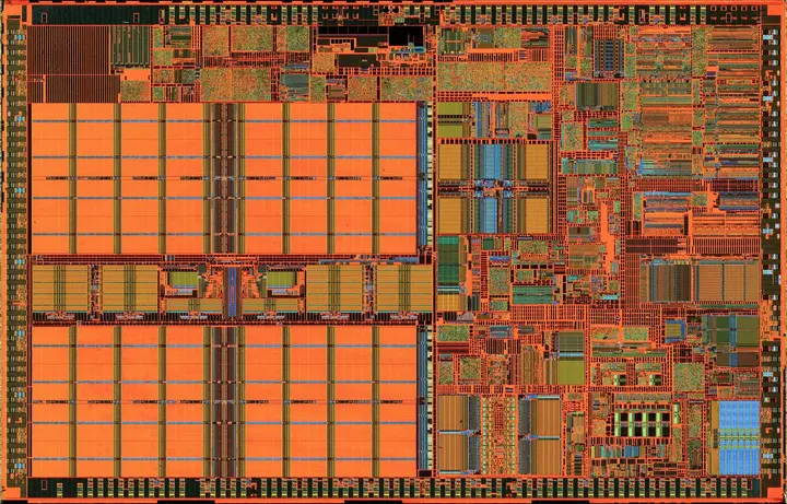 An Intel Pentium III processor die of 2001, etched down to its silicon layer and photographed through a microscope