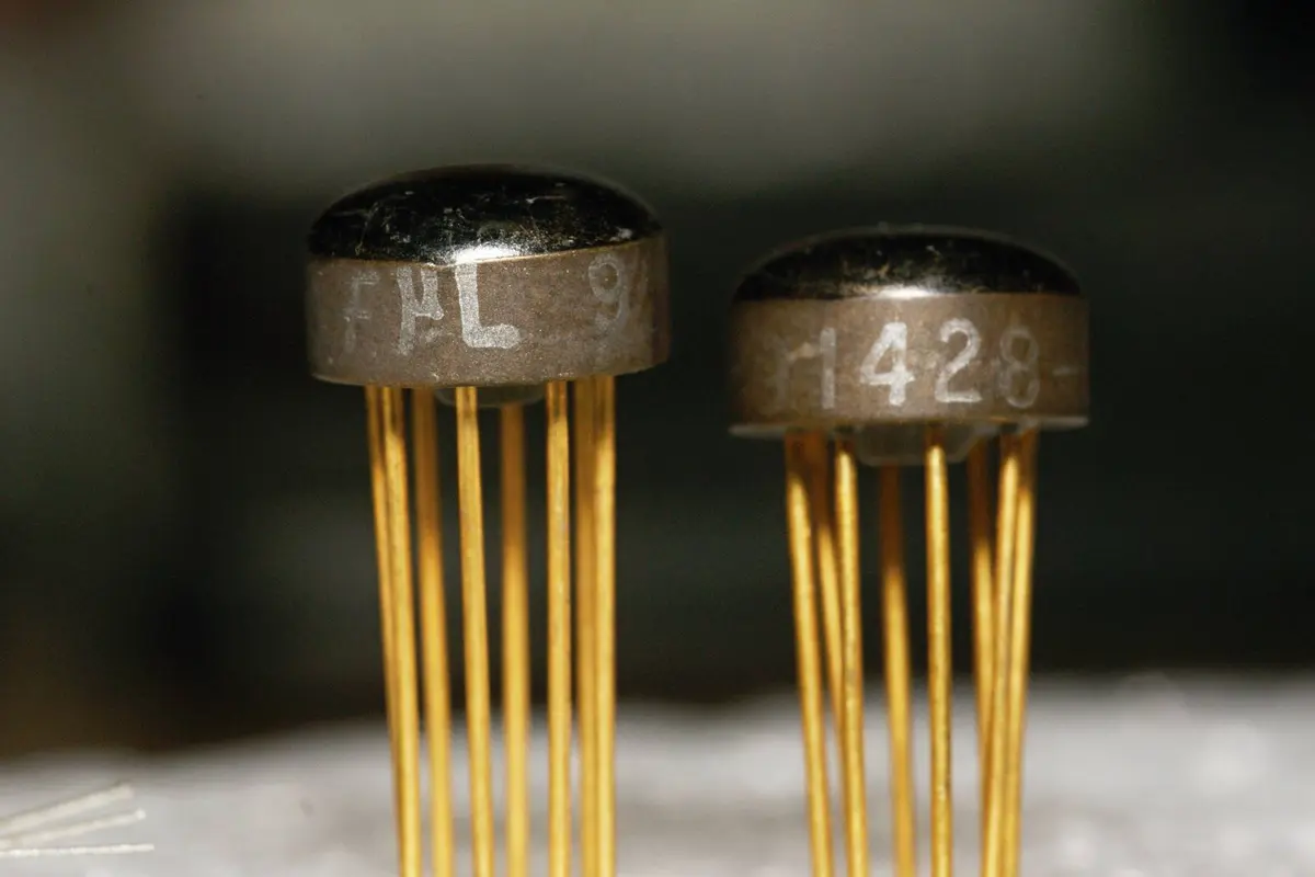 Fairchild Milliwatt Micrologic integrated circuits, designed in 1963, each a complete logic circuit sealed in a metal can