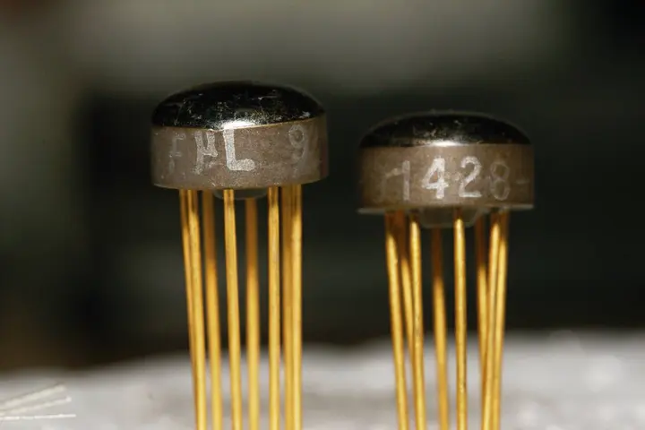 Fairchild Milliwatt Micrologic integrated circuits, designed in 1963, each a complete logic circuit sealed in a metal can