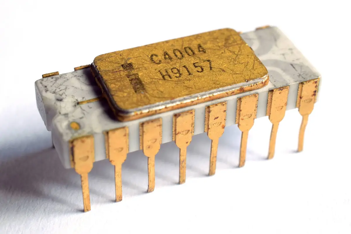 An Intel C4004, the first microprocessor, announced in November 1971 with 2,300 transistors on one chip