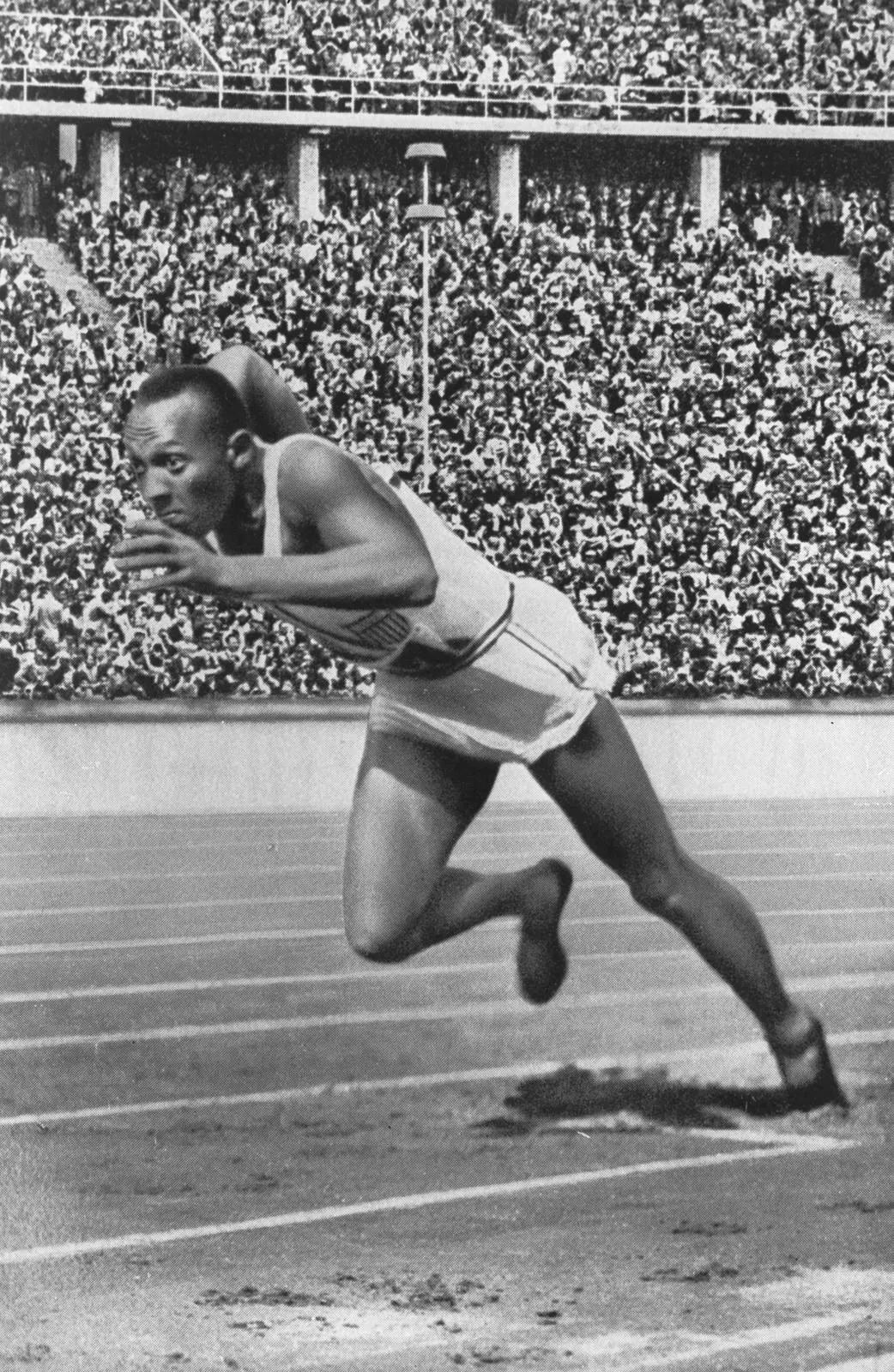 Owens drives out of his start in the Olympic 200 metres, Berlin, 1936