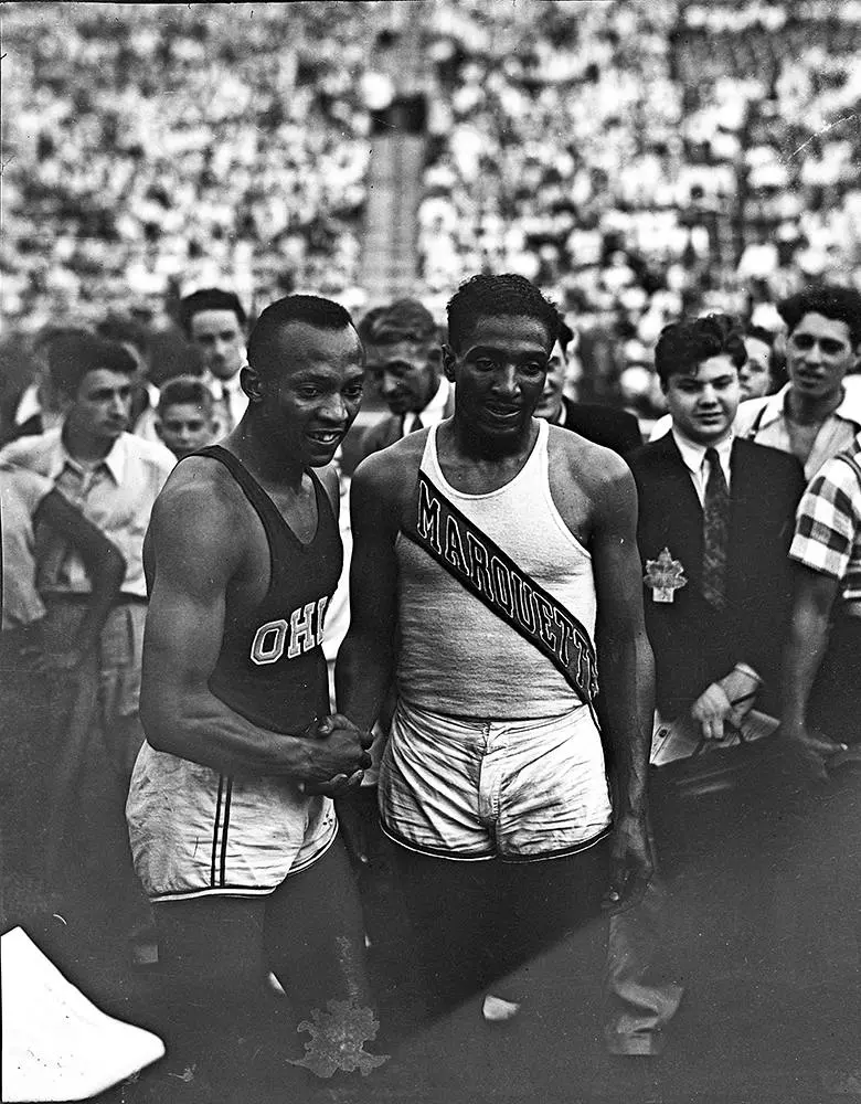 Owens and Ralph Metcalfe at the U.S. Olympic trials on Randall’s Island, New York, July 1936