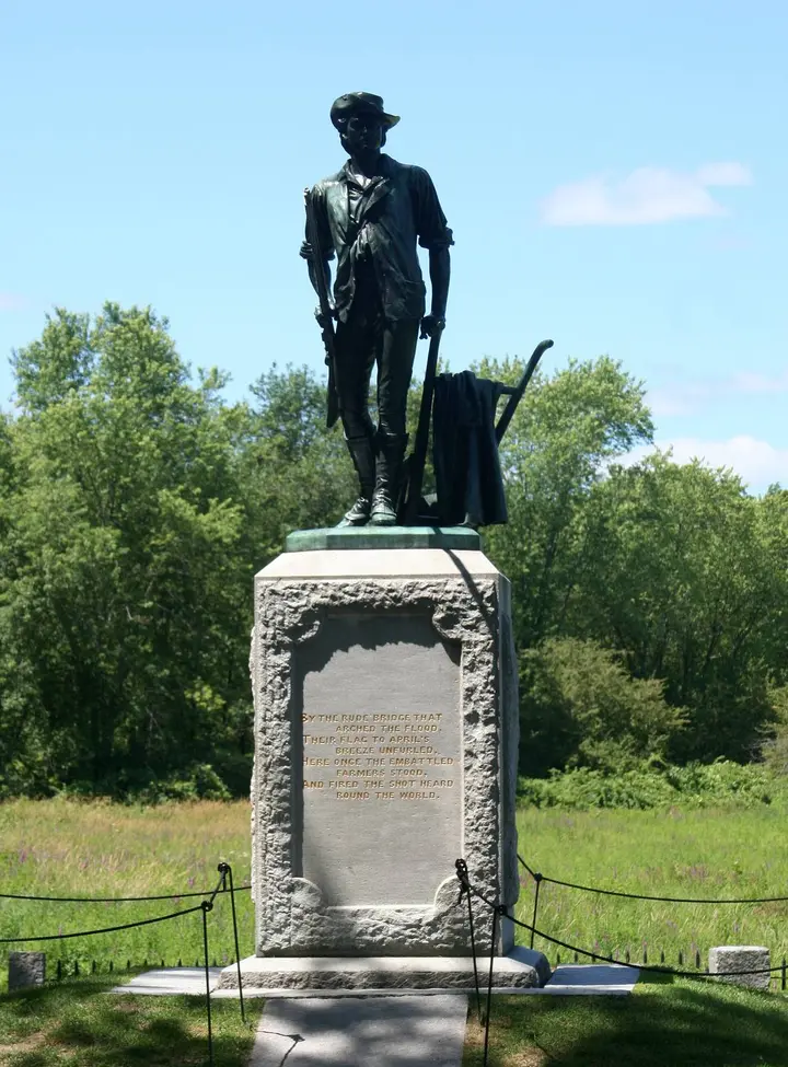 Daniel Chester French’s Minute Man (1875) at the North Bridge, cast from Civil War cannon, with the first stanza of Emerson’s Concord Hymn on its base.