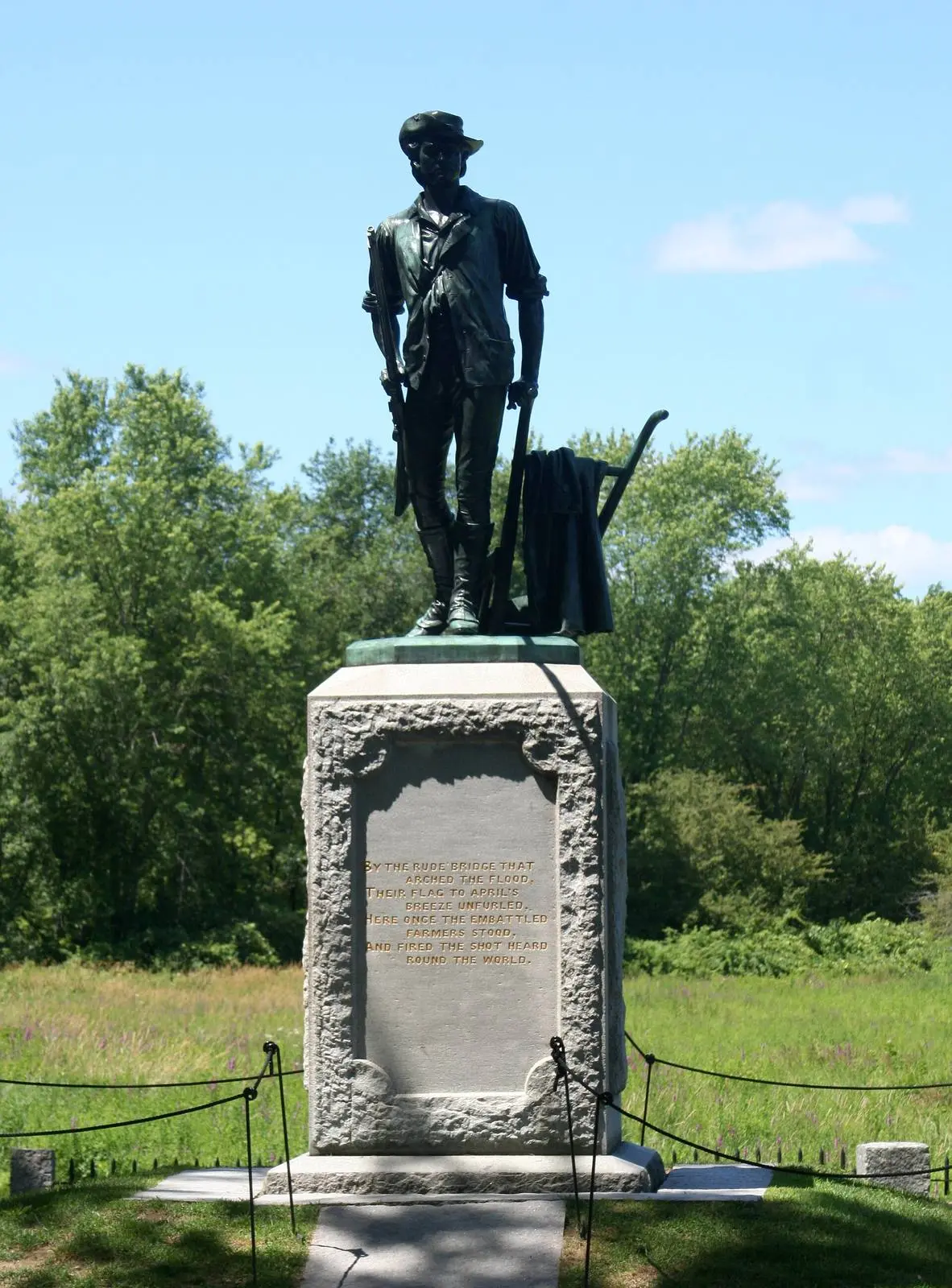 Daniel Chester French’s Minute Man (1875) at the North Bridge, cast from Civil War cannon, with the first stanza of Emerson’s Concord Hymn on its base.