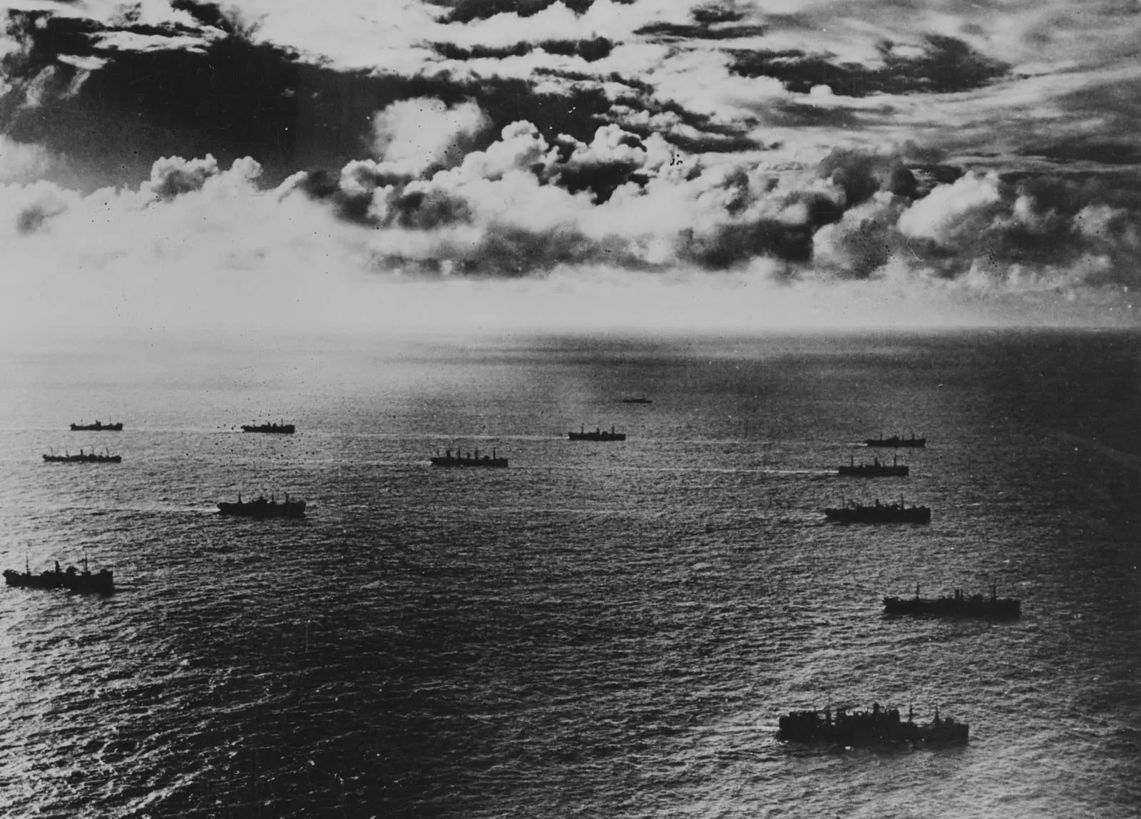 Liberty ships in an Atlantic convoy, about 1942, carrying guns, tanks and planes to the fighting fronts.