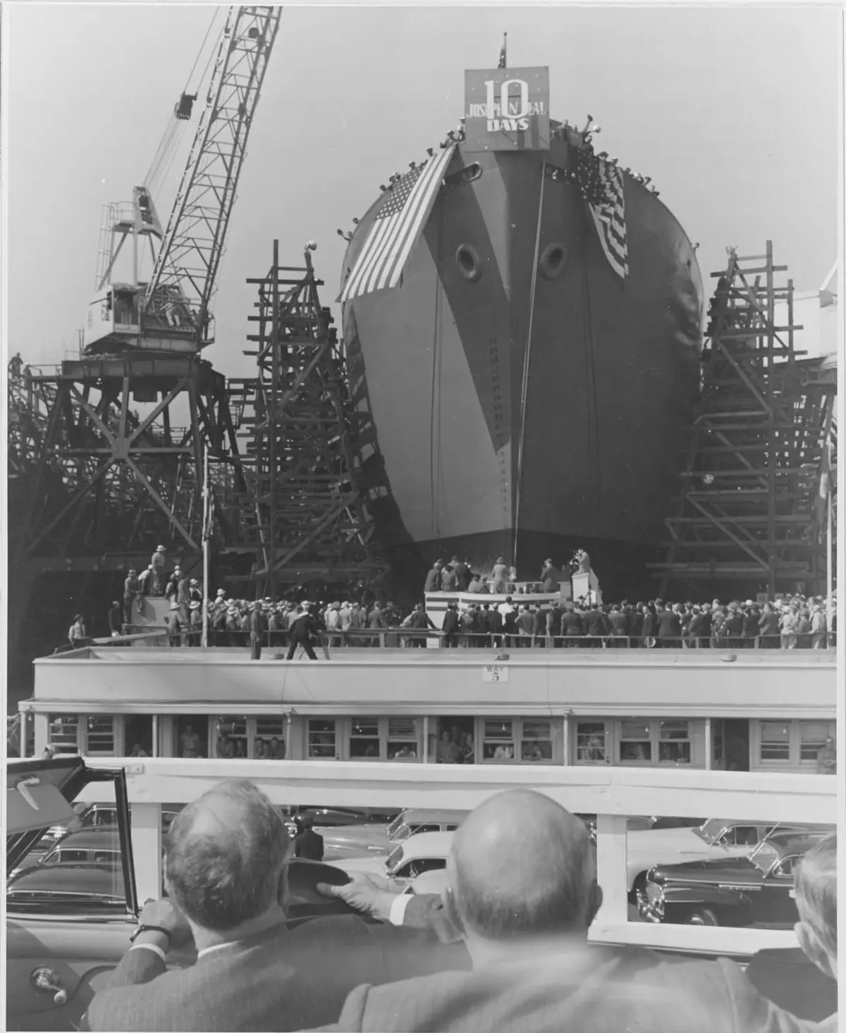 President Roosevelt and Henry J. Kaiser watch the launch of the Joseph N. Teal, built in ten days at Oregon Shipbuilding, Portland, in September 1942.