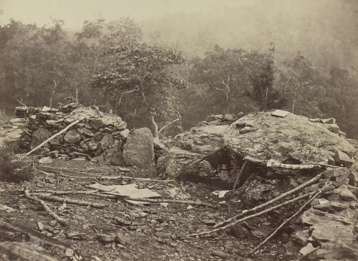 Stone breastworks Union troops threw up on Little Round Top, with Big Round Top behind, photographed by Timothy O'Sullivan in July 1863.