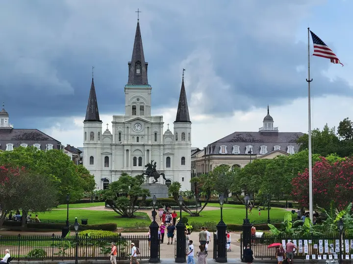 The flag flies over Jackson Square in New Orleans, the old Place d’Armes, with the Cabildo at left and St. Louis Cathedral at center. Here the Stars and Stripes went up over Louisiana on 20 December 1803.