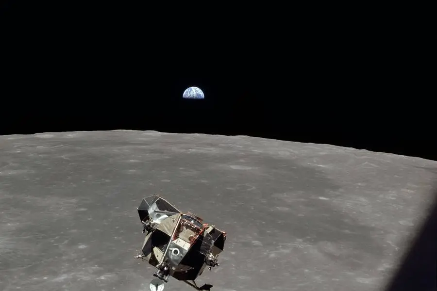 Eagle's ascent stage returns to Columbia with Earth above the lunar horizon, July 21, 1969 (AS11-44-6642)