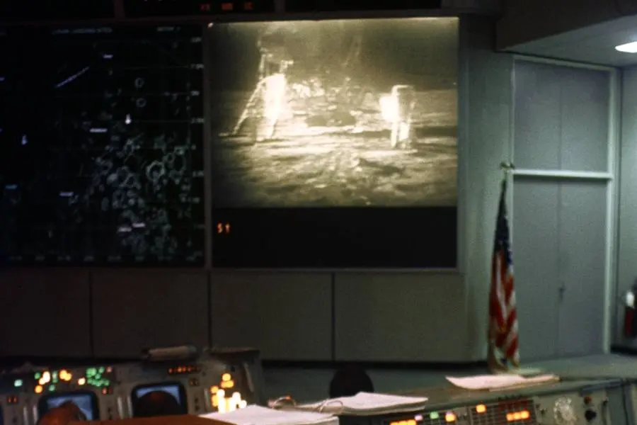 Mission Control watches the Apollo 11 moonwalk on the big screen, July 20, 1969 (S69-39815)