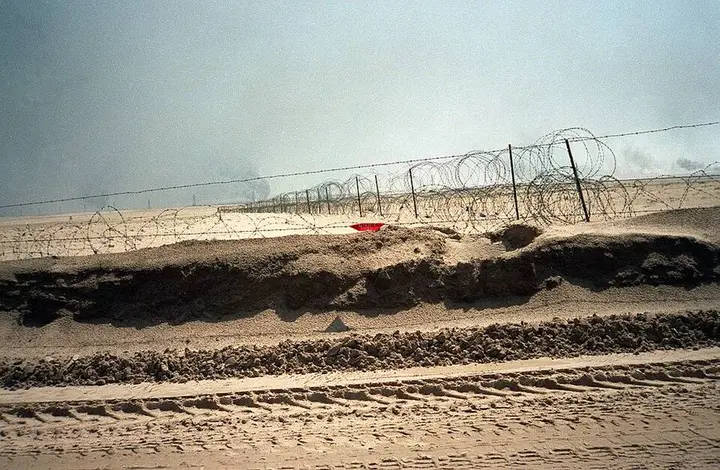 Iraqi wire and berms on the Kuwait-Saudi border, breached by the 1st Marine Division on the first day of the ground war.
