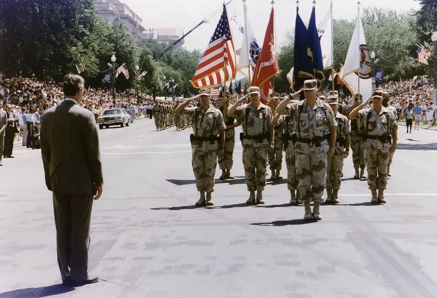 President Bush greets Gen. Norman Schwarzkopf as he leads the Desert Storm homecoming parade in Washington, 8 June 1991.