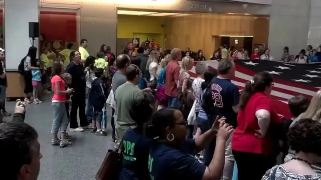 Visitors unfold a full-size replica of the flag at the National Museum of American History (video thumbnail).