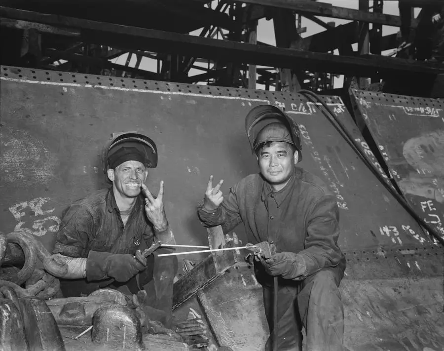 Electric welders at work on the Liberty ship SS Frederick Douglass at Bethlehem-Fairfield, Baltimore, May 1943.