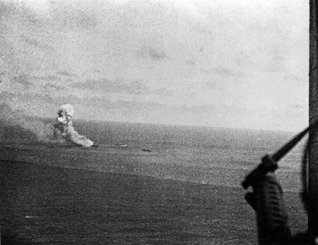 The cruiser Mikuma afire and dead in the water, photographed from the gunner's seat of a Dauntless, 6 June 1942 (80-G-17055).