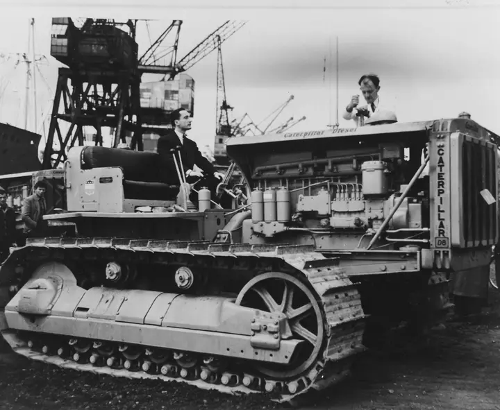 A Caterpillar D8 bulldozer, shipped to France under the Marshall Plan in 1949 to help rebuild the country’s electric power system. The aid shield is painted on its side.