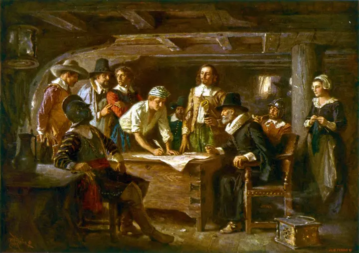 The Mayflower Compact, 1620, as imagined by Jean Leon Gerome Ferris: the men gather around a sea chest in the ship's cabin to sign.