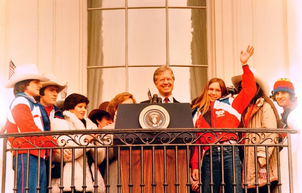 President Carter welcomes the U.S. Winter Olympians, hockey players among them, from the Truman Balcony of the White House, 25 February 1980