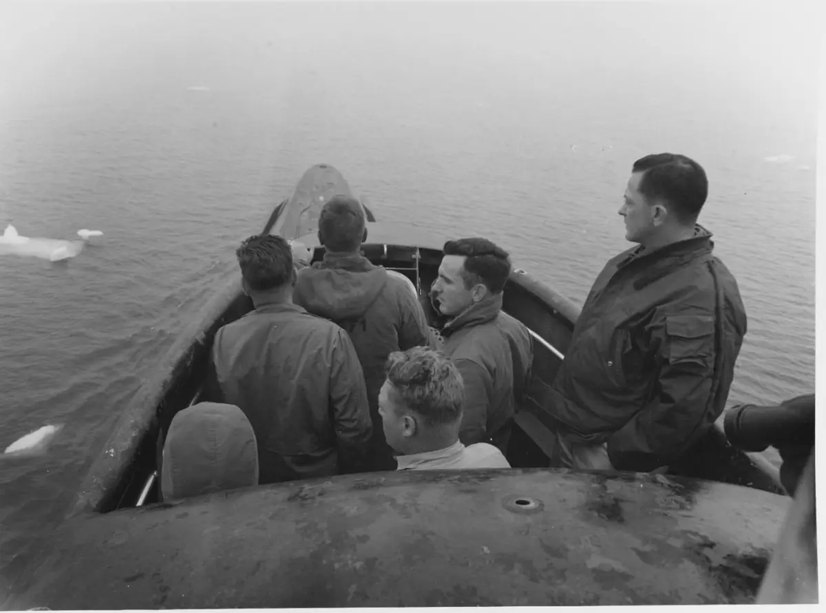 Cmdr. William Anderson (right) on the bridge among drifting ice as Nautilus prepares to pass under the North Pole, August 1958.