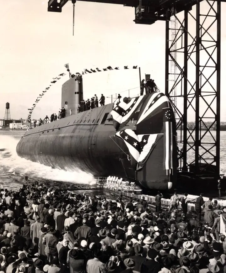 Nautilus slides down the ways into the Thames River at Groton, Connecticut, on 21 January 1954.