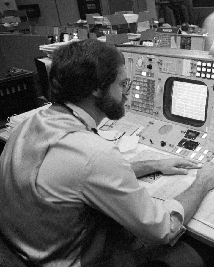 Flight director Neil B. Hutchinson at his console in Mission Control during the launch of STS-2, 12 November 1981 (S81-39433)