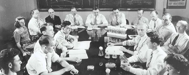 The USDA penicillin team meets in Peoria in June 1944, the month of D-Day. Kenneth Raper sits fourth from left in the back row, Robert Coghill at center and Andrew Moyer seventh.