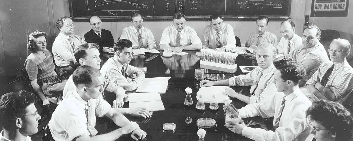 The USDA penicillin team meets in Peoria in June 1944, the month of D-Day. Kenneth Raper sits fourth from left in the back row, Robert Coghill at center and Andrew Moyer seventh.