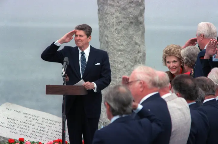 President Reagan salutes at the Ranger Monument on 6 June 1984, the day he called them the boys of Pointe du Hoc.