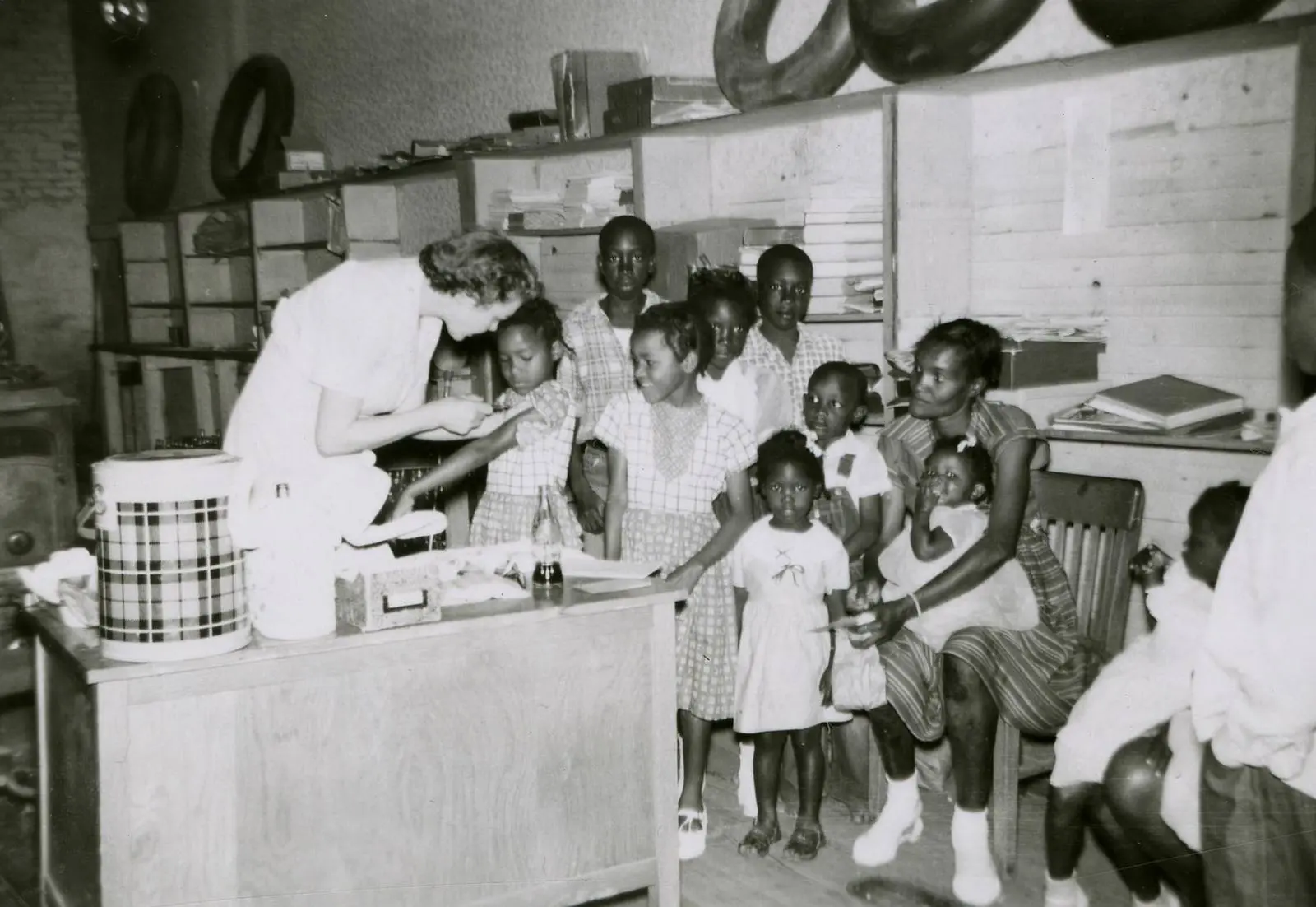 Families wait their turn at a polio vaccine clinic in Mississippi, 1956.