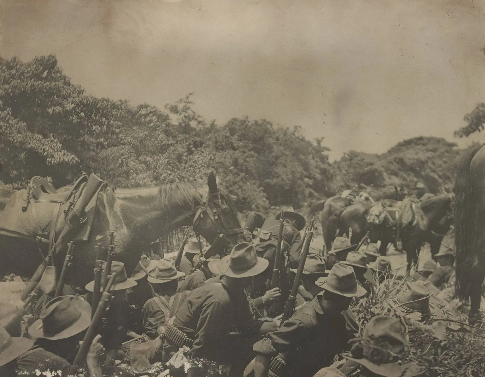Men of the 16th Infantry in the San Juan creek bottom under Spanish fire from San Juan Hill, 1 July 1898
