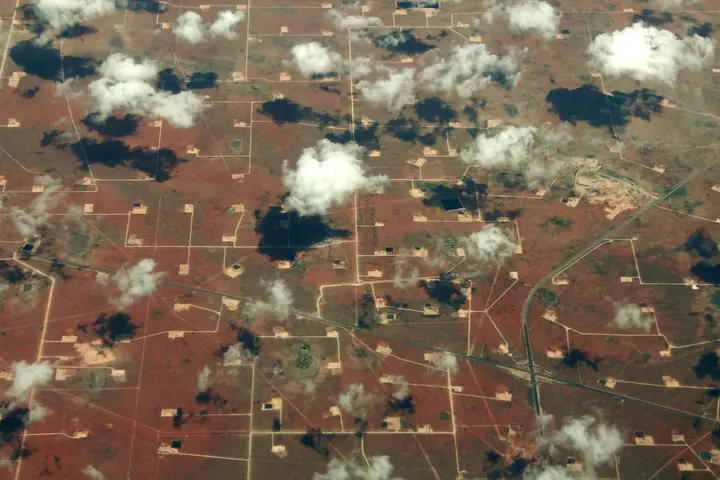 Well pads and roads spread across the Permian Basin near Midland, Texas, like a circuit board, 2014