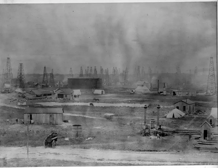 Shacks, tents and boilers of the boomtown camp spread across Spindletop Hill, 1901
