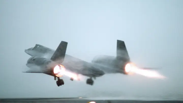 An Air Force SR-71A lights both afterburners on a fog-shrouded takeoff from RAF Mildenhall, England, in 1983.