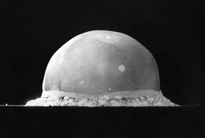 The Trinity fireball 16 thousandths of a second after detonation, already about 200 meters tall, photographed by Berlyn Brixner.